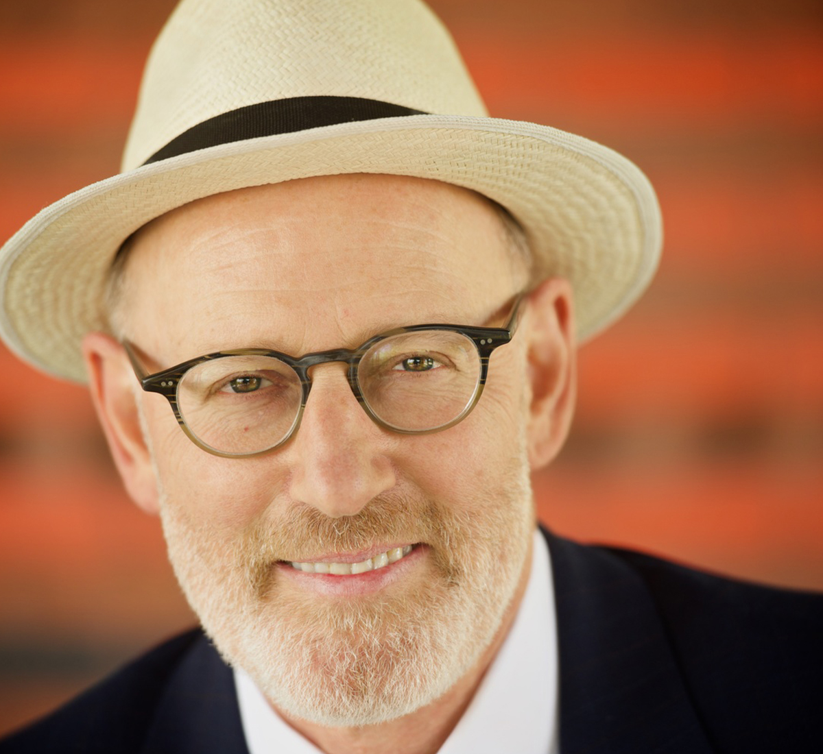 Headshot of a man in a hat