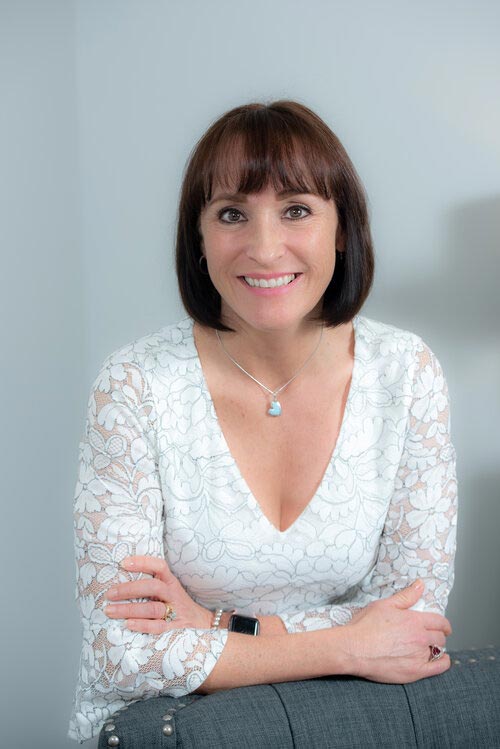 Business headshot of a woman in her office